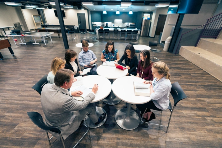 A group of friends gather to study the Bible and have fellowship.